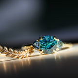 1.82ct Round Teal Precision Cut Montana Sapphire and Trillion Sapphire Low Profile Three Stone Ring in 18k Yellow Gold