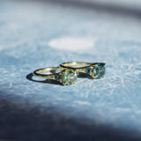 1.82ct Round Teal Precision Cut Montana Sapphire and Trillion Sapphire Low Profile Three Stone Ring in 18k Yellow Gold