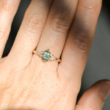 0.73ct Oval Unheated Montana Sapphire and Trillion Diamond Low Profile Ring in 14k Yellow Gold