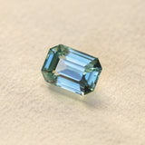 6.91CT UNTREATED EMERALD CUT MADAGASCAR SAPPHIRE, AQUA BLUE GREEN-GREY, 12.1X8.6X6.3MM