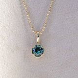 0.86ct Round Blue Montana Sapphire 4 Prong Pendant in 14k Yellow Gold