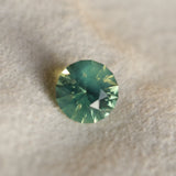 1.29CT ROUND MADAGASCAR SAPPHIRE, SILKY YELLOW GREEN PARTI, UNTREATED, 6.4X4.22MM