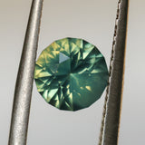 1.29CT ROUND MADAGASCAR SAPPHIRE, SILKY YELLOW GREEN PARTI, UNTREATED, 6.4X4.22MM