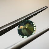 1.29CT ROUND MADAGASCAR SAPPHIRE, SILKY YELLOW GREEN PARTI, UNTREATED, 6.4X4.22MM