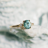 1.20ct Oval Brilliant Teal Montana Sapphire and Princess Cut Diamond Rapids Low Profile Ring in 14k Yellow Gold