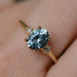 2.01ct Oval Precision Cut Denim Blue Untreated Montana Sapphire and Princess Cut Diamond Rapids Low Profile Ring in 18k Yellow Gold