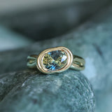 1.93ct Untreated Oval Brilliant Nigerian Parti Sapphire East-West Bezel Solitaire Alluvial Style Ring in 14k Green Gold