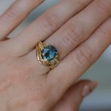4.20ct Oval Blue Madagascar Sapphire in Wandering Vine Low Profile 4 Prong Setting with Diamonds in 18k Yellow Gold