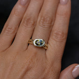 1.52ct Untreated Oval Brilliant Nigerian Parti Sapphire East-West Bezel Solitaire Alluvial Style Ring in 14k Green Gold