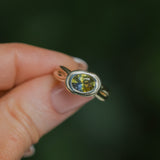 1.52ct Untreated Oval Brilliant Nigerian Parti Sapphire East-West Bezel Solitaire Alluvial Style Ring in 14k Green Gold