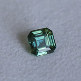 2.16CT MADAGASCAR EMERALD CUT SAPPHIRE, DEEP GREEN WITH SOME YELLOW AND TEAL, 6.9X6.8X4.6MM