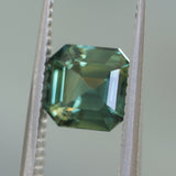 2.16CT MADAGASCAR EMERALD CUT SAPPHIRE, DEEP GREEN WITH SOME YELLOW AND TEAL, 6.9X6.8X4.6MM