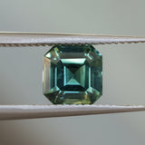 2.16CT MADAGASCAR EMERALD CUT SAPPHIRE, DEEP GREEN WITH SOME YELLOW AND TEAL, 6.9X6.8X4.6MM