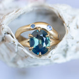 4.07ct Oval Deep Teal Sapphire Low Profile Six Prong Split Shank Solitaire in 14k Yellow Gold