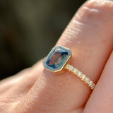 1.27ct Radiant Cut Madagascar Teal Sapphire Low Profile Bezel Solitaire Ring with French Set Diamonds in 14k Yellow Gold