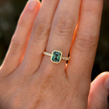 1.27ct Radiant Cut Madagascar Teal Sapphire Low Profile Bezel Solitaire Ring with French Set Diamonds in 14k Yellow Gold