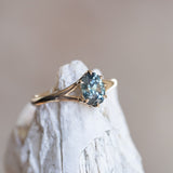 1.46ct Oval Precision Cut Montana Sapphire Low Profile Six Prong Split Shank Solitaire in 14k Yellow Gold