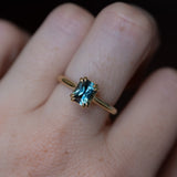 1.68ct Radiant Cut Teal Sapphire Cathedral Double Prong Solitaire in 18k Yellow Gold