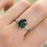 4.26ct Oval Deep Teal Madagascar Sapphire Double Claw Prong Low Profile Milgrain and Diamond Ring in Platinum