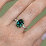 4.26ct Oval Deep Teal Madagascar Sapphire Double Claw Prong Low Profile Milgrain and Diamond Ring in Platinum