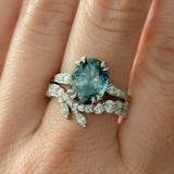 3.94ct Oval Unheated Deep Teal Blue Australian Sapphire Double Claw Prong Low Profile Milgrain and Diamond Ring in Platinum