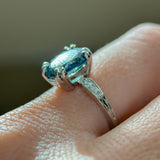 3.94ct Oval Unheated Deep Teal Blue Australian Sapphire Double Claw Prong Low Profile Milgrain and Diamond Ring in Platinum