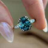 3.94ct Oval Unheated Deep Teal Blue Australian Sapphire Double Claw Prong Low Profile Milgrain and Diamond Ring in Platinum