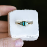 1.30ct Emerald Cut Madagascar Sapphire and 0.98ctw Montana Sapphire Three Stone Low Profile Ring in 18k Yellow Gold