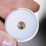 1.50CT ROUND MADAGASCAR SAPPHIRE, BROWN WITH ORANGE AND GREEN FLASHES, 6.7MM