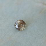 1.50CT ROUND MADAGASCAR SAPPHIRE, BROWN WITH ORANGE AND GREEN FLASHES, 6.7MM