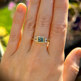 1.06ct Unheated Step Cut Teal Bezel Set Sapphire and White Cadillac Prong Set Sapphire Low Profile Three Stone Ring in 14k Yellow Gold