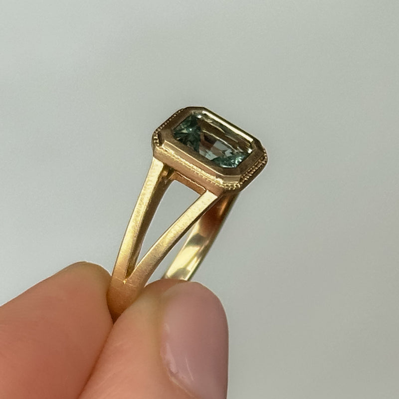 1.20ct Radiant Cut Seafoam Montana Sapphire Split Shank Bezel Ring with Milgrain in 14k Yellow Gold