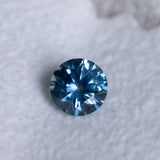 1.19CT ROUND PRECISION CUT MONTANA SAPPHIRE, OCEAN BLUE TEAL, 6X4MM