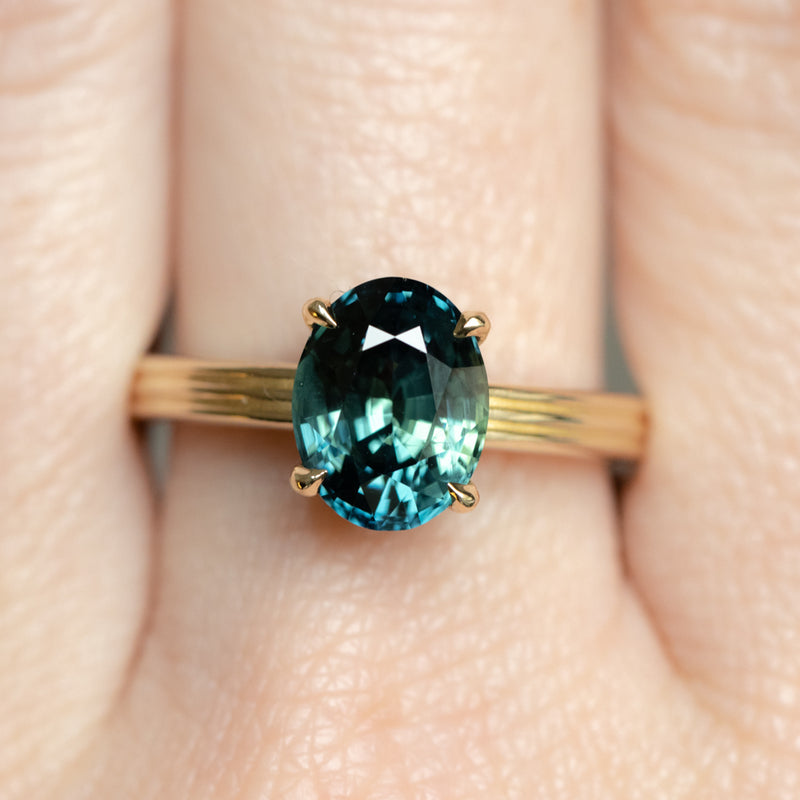 3.59ct Oval Deep Teal Madagascar Sapphire Low Profile Tri-Band "Three Winds" 4 Prong Solitaire in 14k Yellow Gold