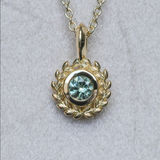 Round Precision Cut Montana Sapphire Vine Frame Bezel Set Pendants in 14k and 18k Yellow Gold