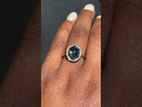 4.48ct Oval Cabochon Parti Sapphire and Blackened Halo ring in 18k Yellow Gold