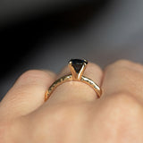 1.03ct Round Blue Australian Sapphire Evergreen Solitaire in 14k Yellow Gold on hand