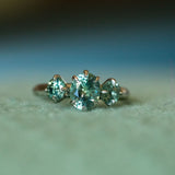 1.32ct Oval Minty Montana Sapphire and Madagascar Sapphire Three Stone Ring in Platinum on table