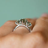 1.32ct Oval Minty Montana Sapphire and Madagascar Sapphire Three Stone Ring in Platinum on hand