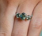 1.32ct Oval Minty Montana Sapphire and Madagascar Sapphire Three Stone Ring in Platinum on hand