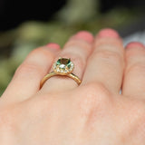 1.38ct Oval Green Montana Sapphire 18k Yellow Satin Evergreen Halo Ring on hand