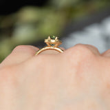 1.38ct Oval Green Montana Sapphire 18k Yellow Satin Evergreen Halo Ring on hand