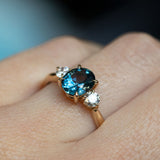 1.54ct Oval Montana Sapphire and Diamond Three Stone Ring in 14k Yellow Gold on hand
