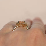 1.64ct Peach Sapphire and Asymmetrical Diamond Cluster Ring in 14k Yellow Gold on hand