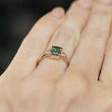 1.16ct Teal Green Radiant Cut Montana Sapphire and Trillion Diamond Low Profile Three Stone ring in 14k Yellow Gold