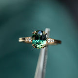 1.80ct Oval Nigerian Parti Sapphire Vintage Cathedral Ring in 14k Yellow Gold in tweezers