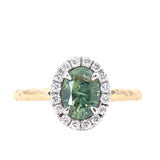 1.20ct Silky Oval Green Madagascar Sapphire and Diamond Four Prong Halo Ring in 14K White Gold Halo and 14k Yellow Gold Shank