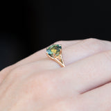2.40ct Oval Teal Green Parti Sapphire Evergreen Carved Split Shank Six Prong Ring in 14k Yellow Gold on hand