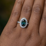 2.72ct Oval Australian Parti Sapphire and Double Diamond Halo in Platinum on the hand