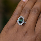 2.72ct Oval Australian Parti Sapphire and Double Diamond Halo in Platinum on the hand